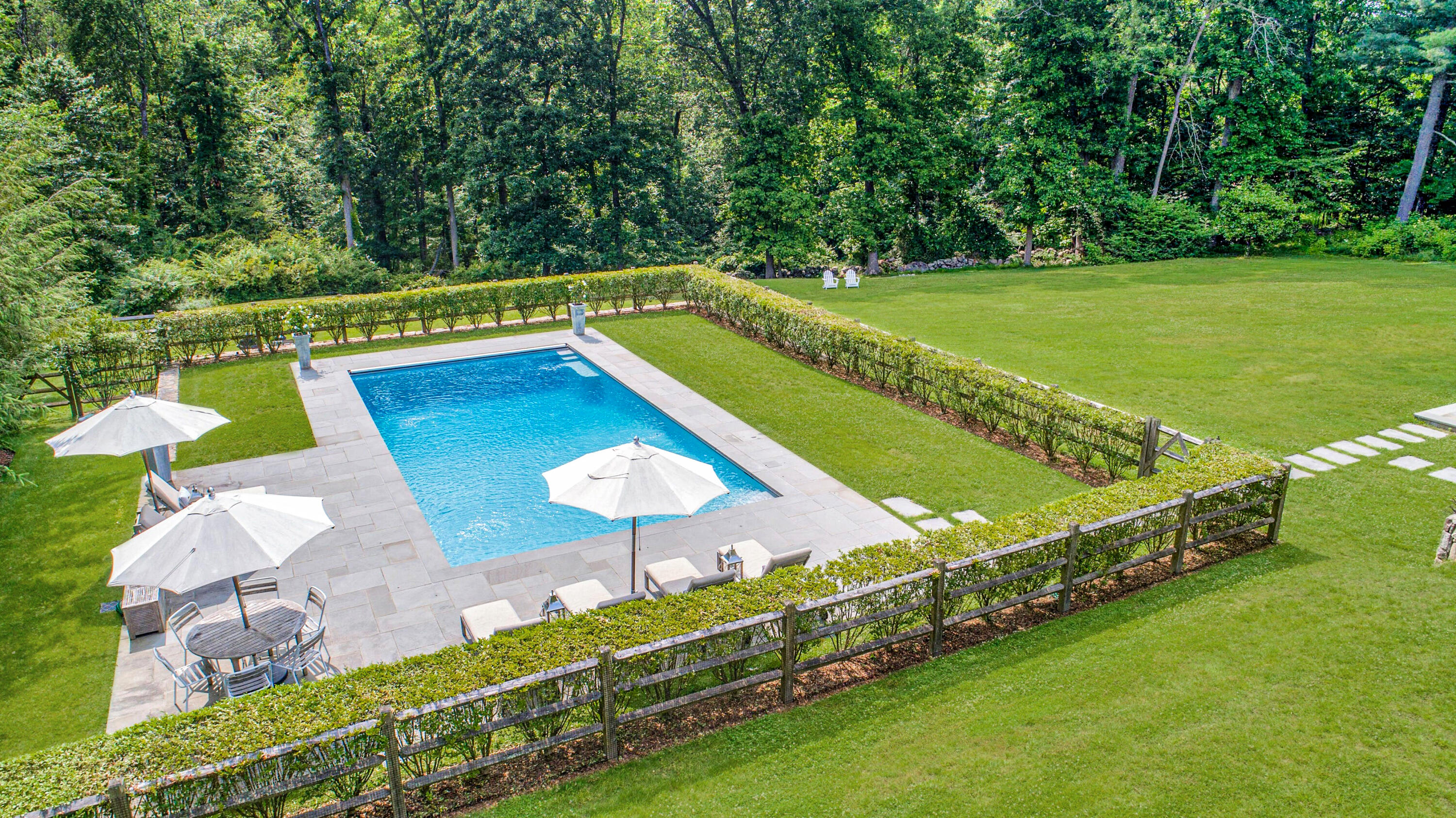 527 Middlesex Road Darien, CT 06820 - Photo 3 of 51 a view of a backyard with swimming pool