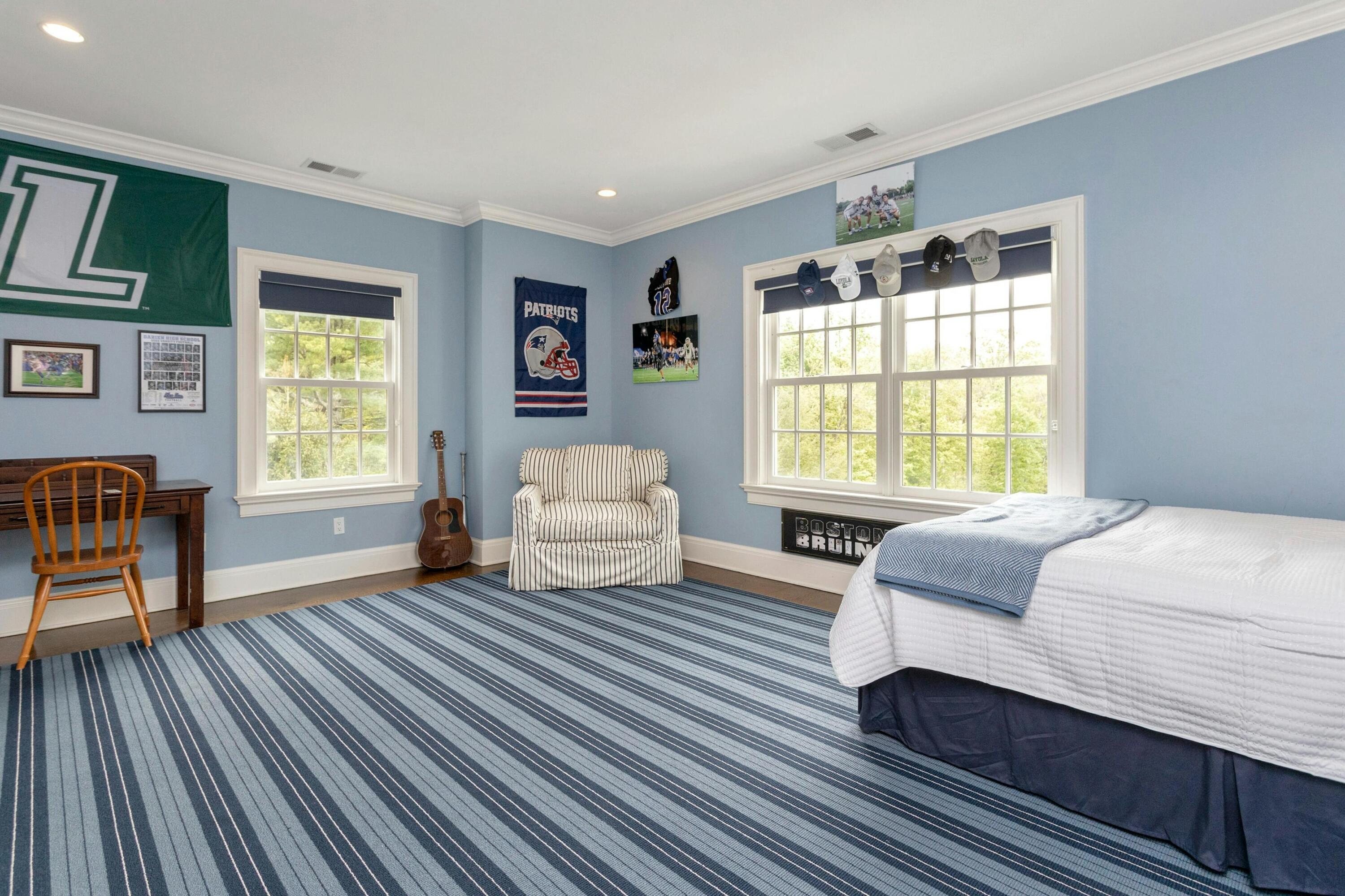 527 Middlesex Road Darien, CT 06820 - Photo 34 of 51 a bedroom with a bed and wooden floor