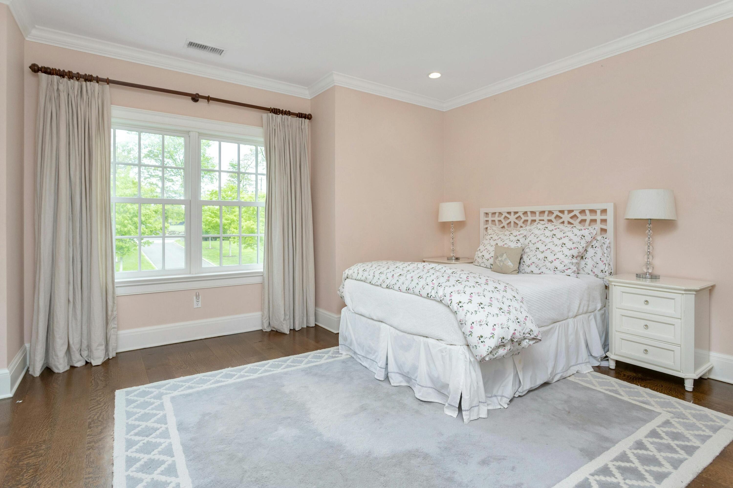 527 Middlesex Road Darien, CT 06820 - Photo 38 of 51 a bedroom with a bed and a window