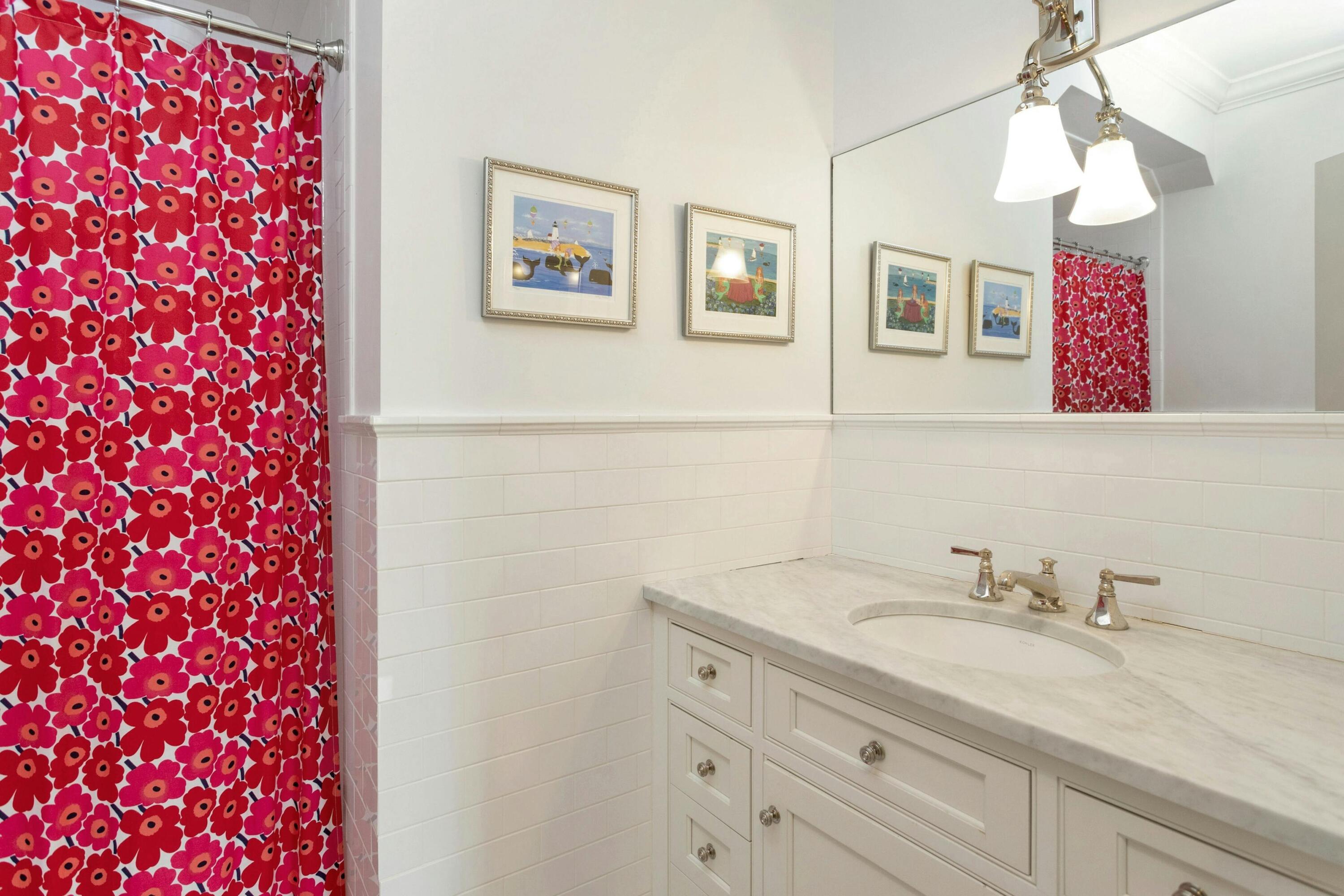 527 Middlesex Road Darien, CT 06820 - Photo 40 of 51 a bathroom with a granite countertop sink a mirror and shower
