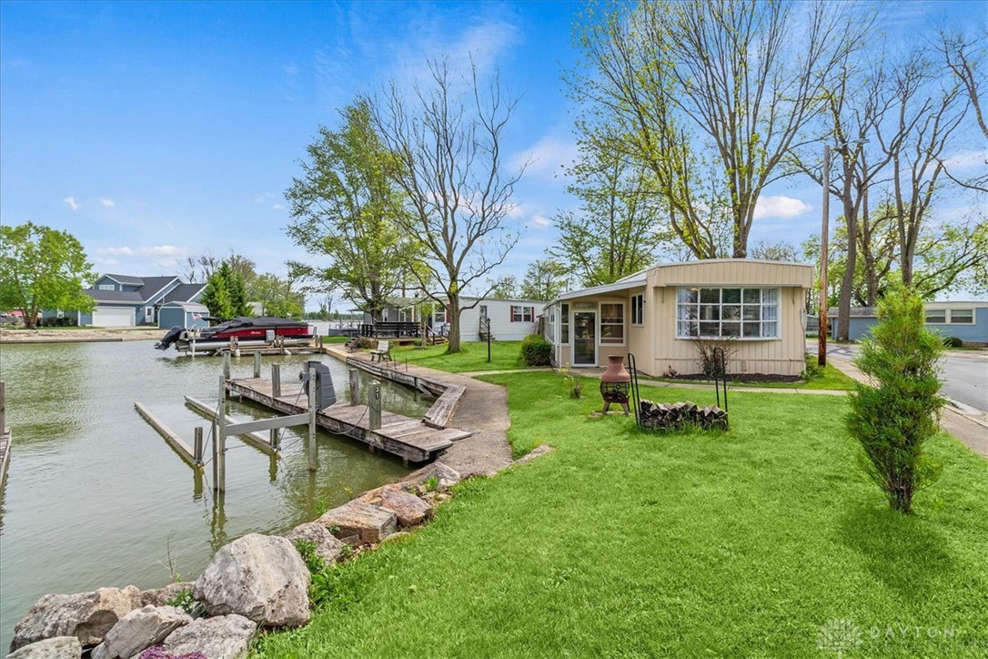 246 North Orchard Island Road Russells Point, OH 43348 - Photo 2 of 43 This charming lakeside home offers direct water access and private boat docks for seamless aquatic enjoyment.