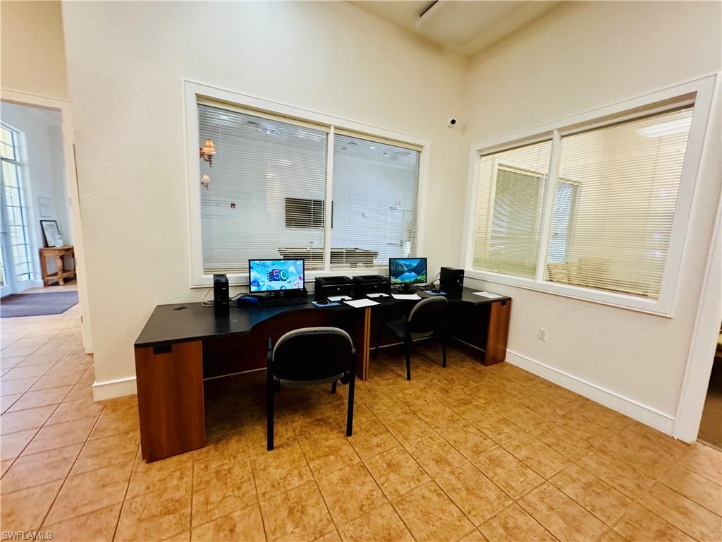 8244 Key Royal Circle, Unit 633 Naples, FL 34119 - Photo 17 of 28 a living room with furniture and a window