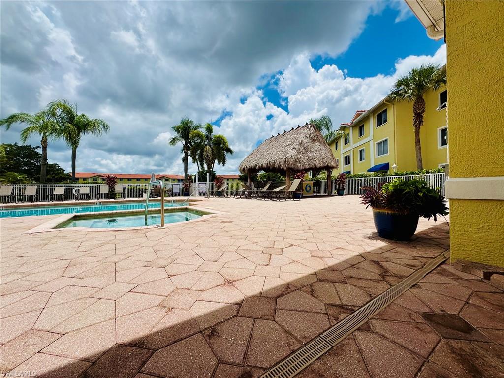 8244 Key Royal Circle, Unit 633 Naples, FL 34119 - Photo 23 of 28 a view of a yard with plants