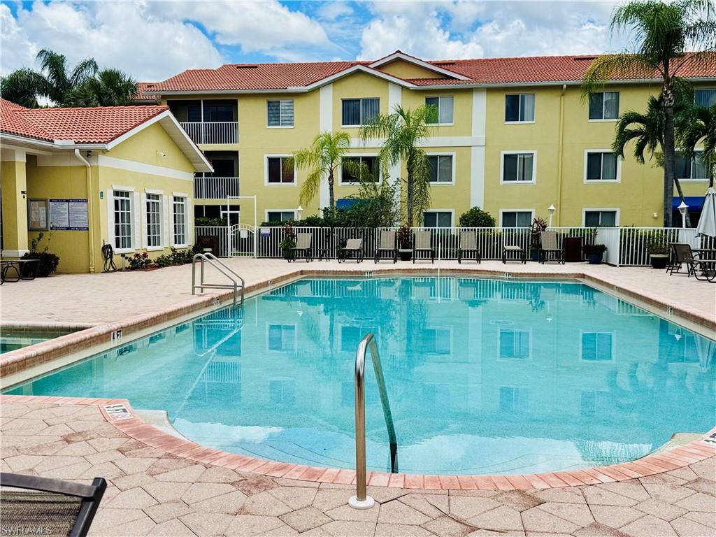 8244 Key Royal Circle, Unit 633 Naples, FL 34119 - Photo 24 of 28 a front view of a house with swimming pool