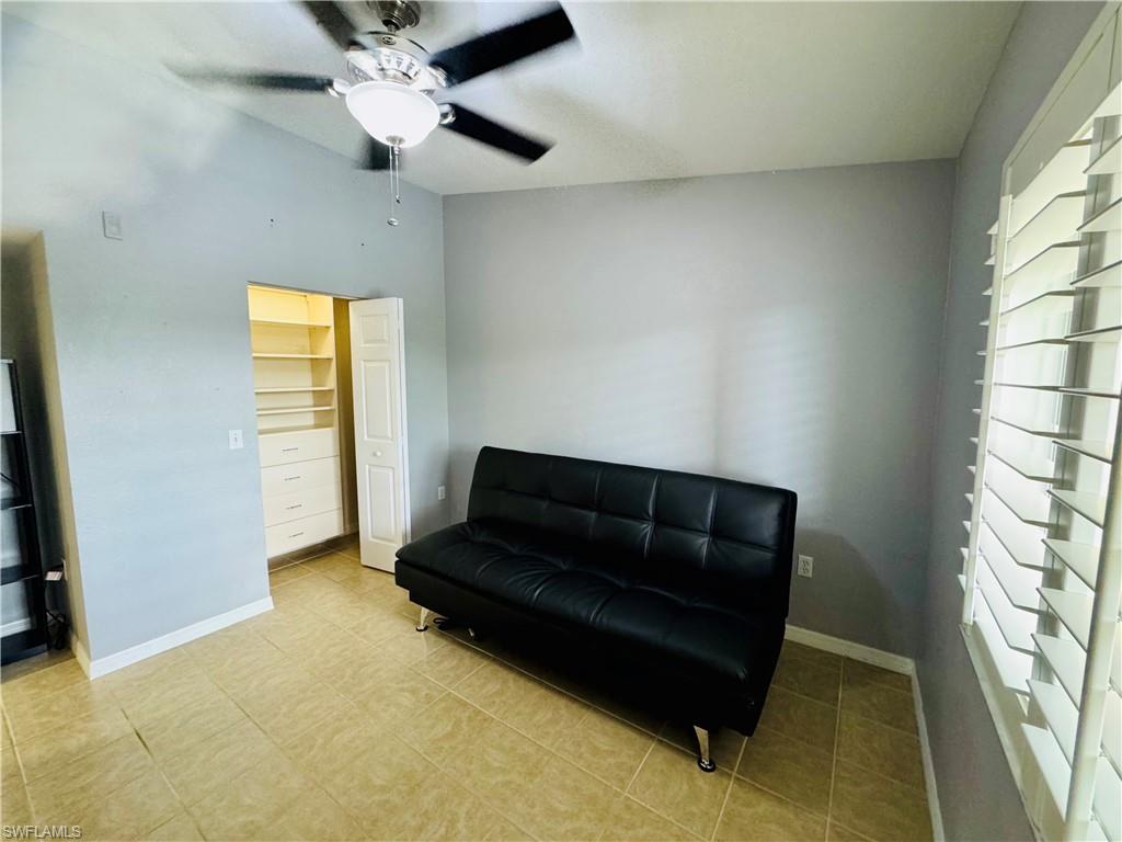 8244 Key Royal Circle, Unit 633 Naples, FL 34119 - Photo 9 of 28 a living room with furniture and a window