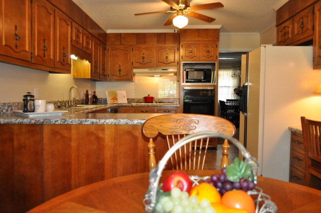 5237 Zebulon Road Macon, GA 31210 - Photo 2 of 33 a kitchen with stainless steel appliances granite countertop a sink a stove and a refrigerator