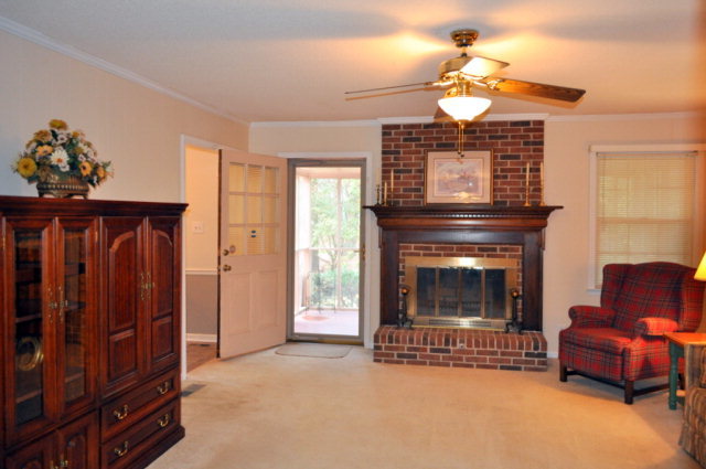 5237 Zebulon Road Macon, GA 31210 - Photo 14 of 33 a living room with furniture and a fireplace
