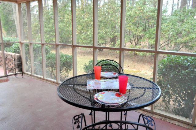 5237 Zebulon Road Macon, GA 31210 - Photo 17 of 33 a dining room with a glass table and chairs