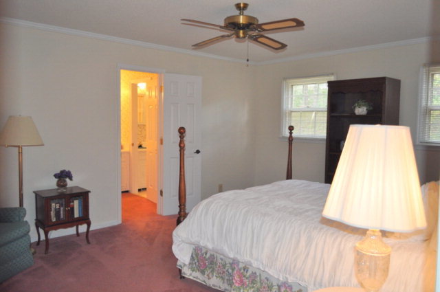 5237 Zebulon Road Macon, GA 31210 - Photo 20 of 33 a bedroom with a bed and a lamp