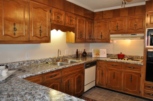 5237 Zebulon Road Macon, GA 31210 - Photo 3 of 33 a kitchen with stainless steel appliances granite countertop a sink stove and cabinets