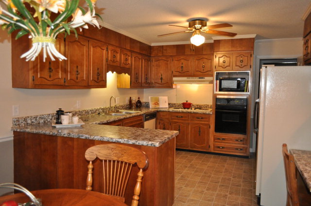 5237 Zebulon Road Macon, GA 31210 - Photo 25 of 33 a kitchen with a sink appliances and cabinets