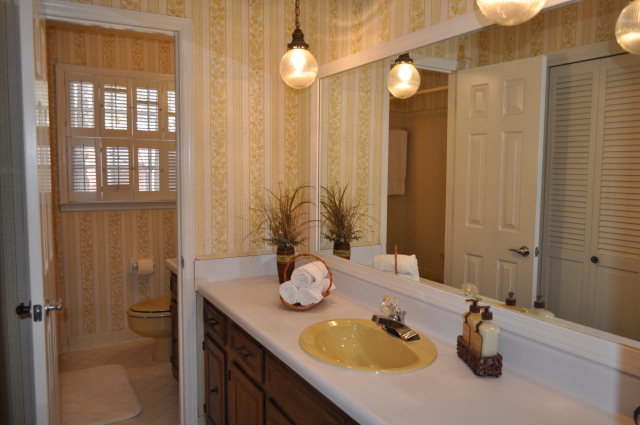 5237 Zebulon Road Macon, GA 31210 - Photo 30 of 33 a bathroom with a granite countertop sink and a mirror