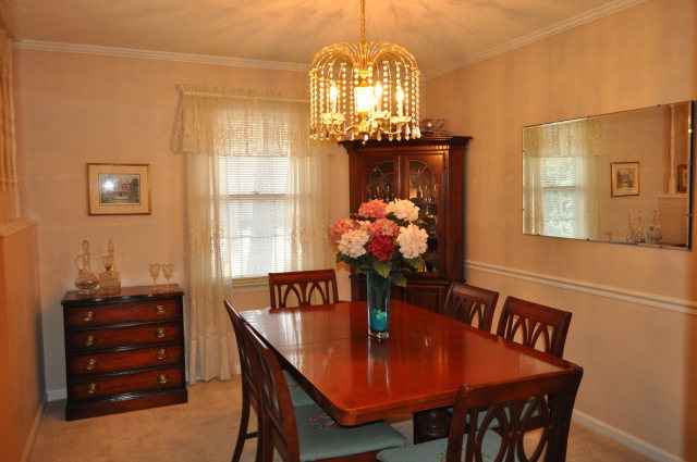 5237 Zebulon Road Macon, GA 31210 - Photo 4 of 33 a view of a dining room with furniture and chandelier