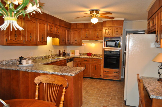 5237 Zebulon Road Macon, GA 31210 - Photo 33 of 33 a kitchen with stainless steel appliances granite countertop a sink a stove a refrigerator and island