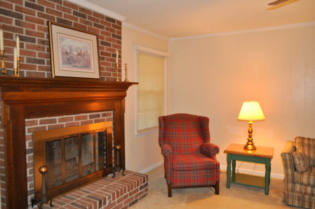 5237 Zebulon Road Macon, GA 31210 - Photo 5 of 33 a living room with furniture and a fireplace