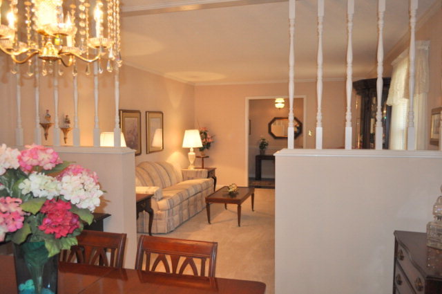 5237 Zebulon Road Macon, GA 31210 - Photo 8 of 33 a living room with furniture and flowers