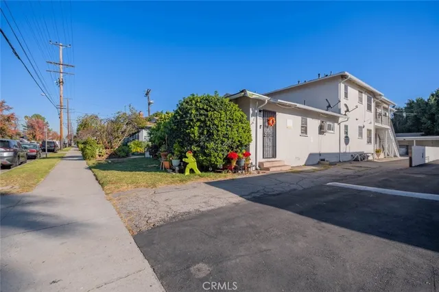 a view of a house with a street