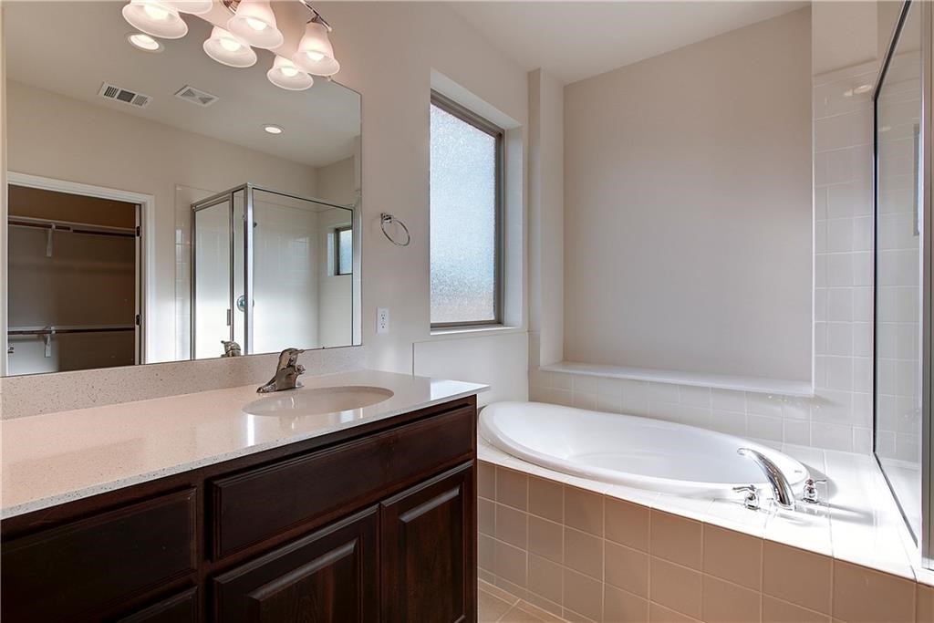 6907 Idea Road Austin, TX 78741 - Photo 24 of 29 2nd level primary bath with garden tub