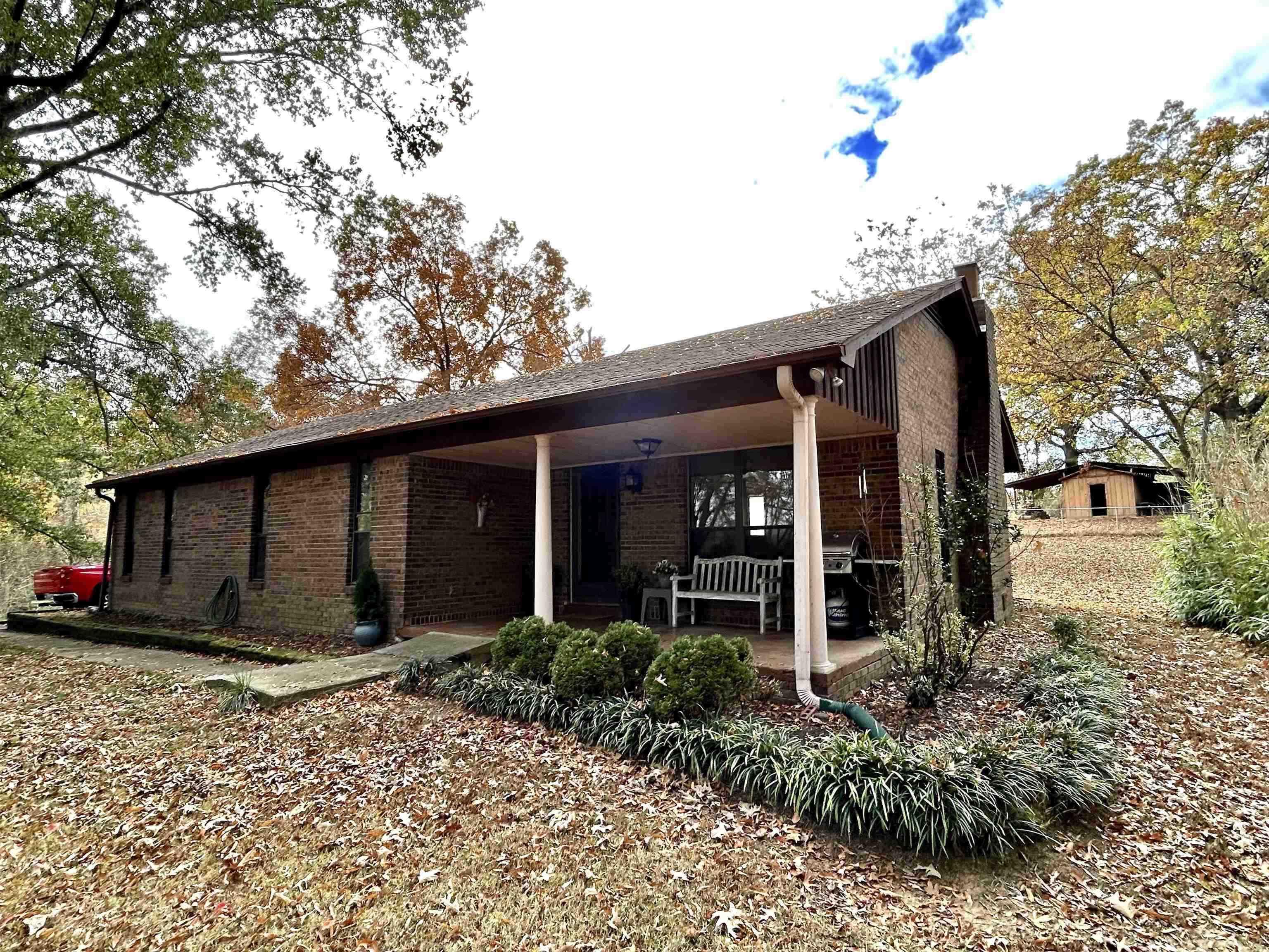 Back of property with brick siding