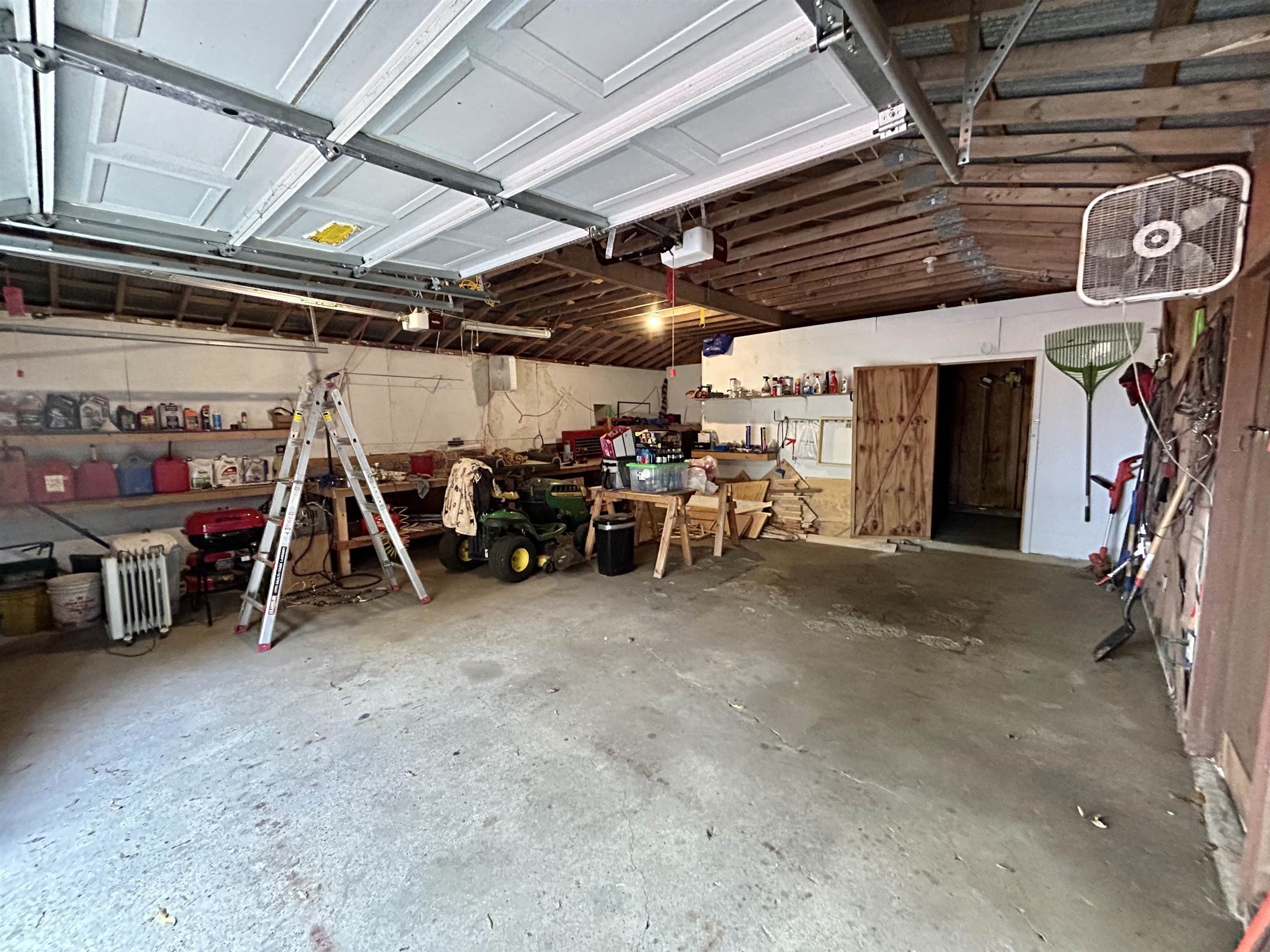 3975 Billion Road Memphis, TN 38127 - Photo 8 of 9 Garage featuring a workshop area and a garage door opener