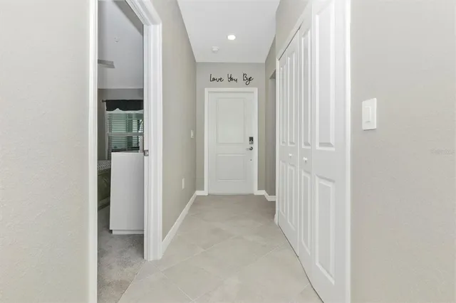 a kitchen with a sink a window and chairs