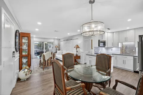 a bathroom with a sink toilet vanity and shower