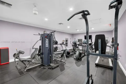 a living room with furniture a rug and a large window