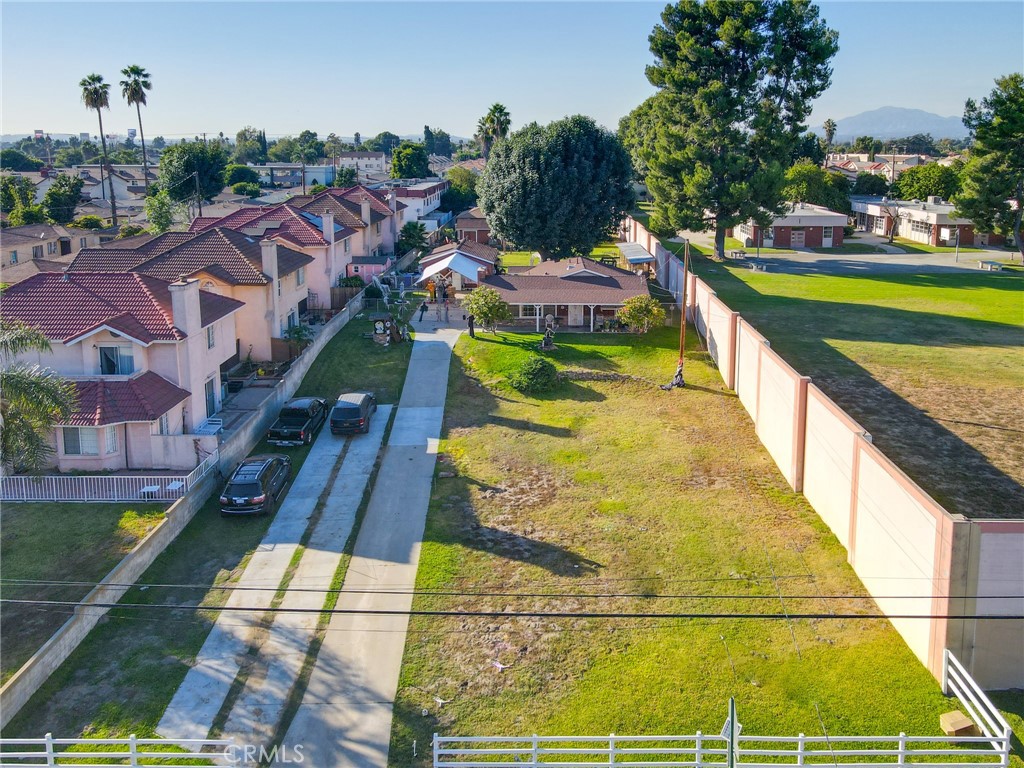 3903 Gilman Road El Monte, CA 91732 - Photo 3 of 11 a view of a swimming pool with a patio and yard