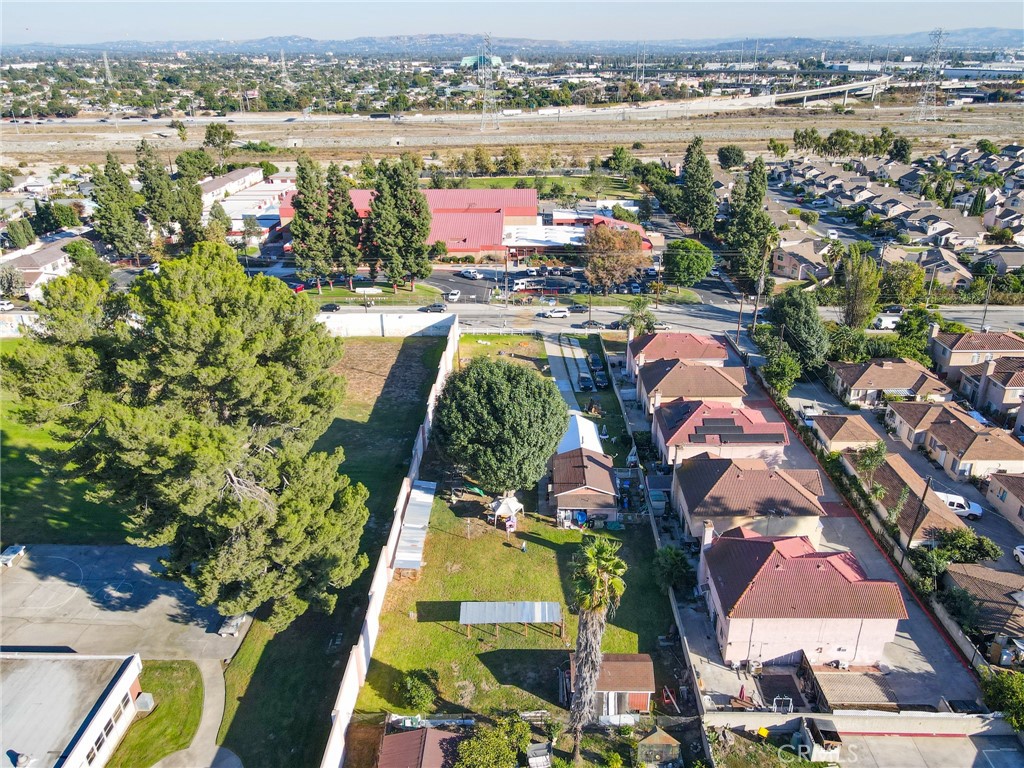 3903 Gilman Road El Monte, CA 91732 - Photo 8 of 11 an aerial view of residential houses with outdoor space and swimming pool