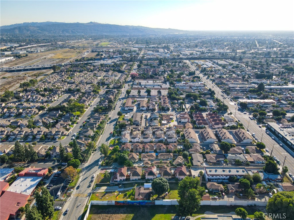 3903 Gilman Road El Monte, CA 91732 - Photo 9 of 11 an aerial view of residential houses with outdoor space and trees