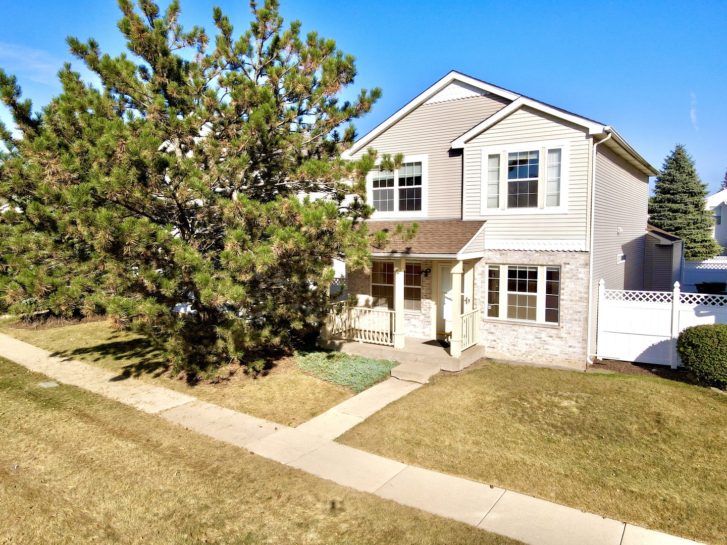 138 Mountain Laurel Court Romeoville, IL 60446 - Photo 1 of 26 a view of a white house with a yard