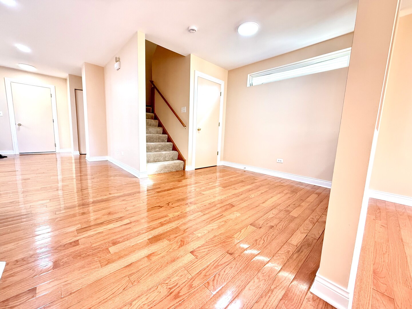 138 Mountain Laurel Court Romeoville, IL 60446 - Photo 3 of 26 a view of an empty room with wooden floor