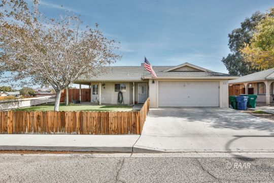340 North Kern Street Ridgecrest, CA 93555 - Photo 1 of 33 a front view of a house with a garden