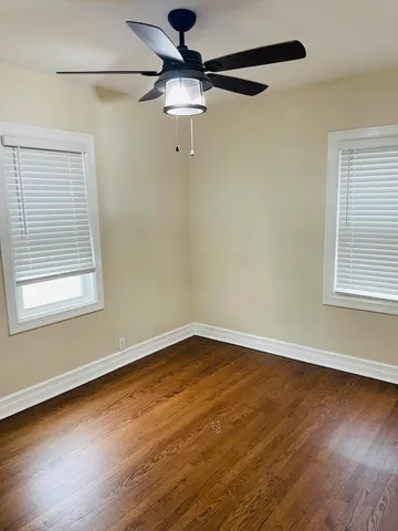 a bedroom with bed and window
