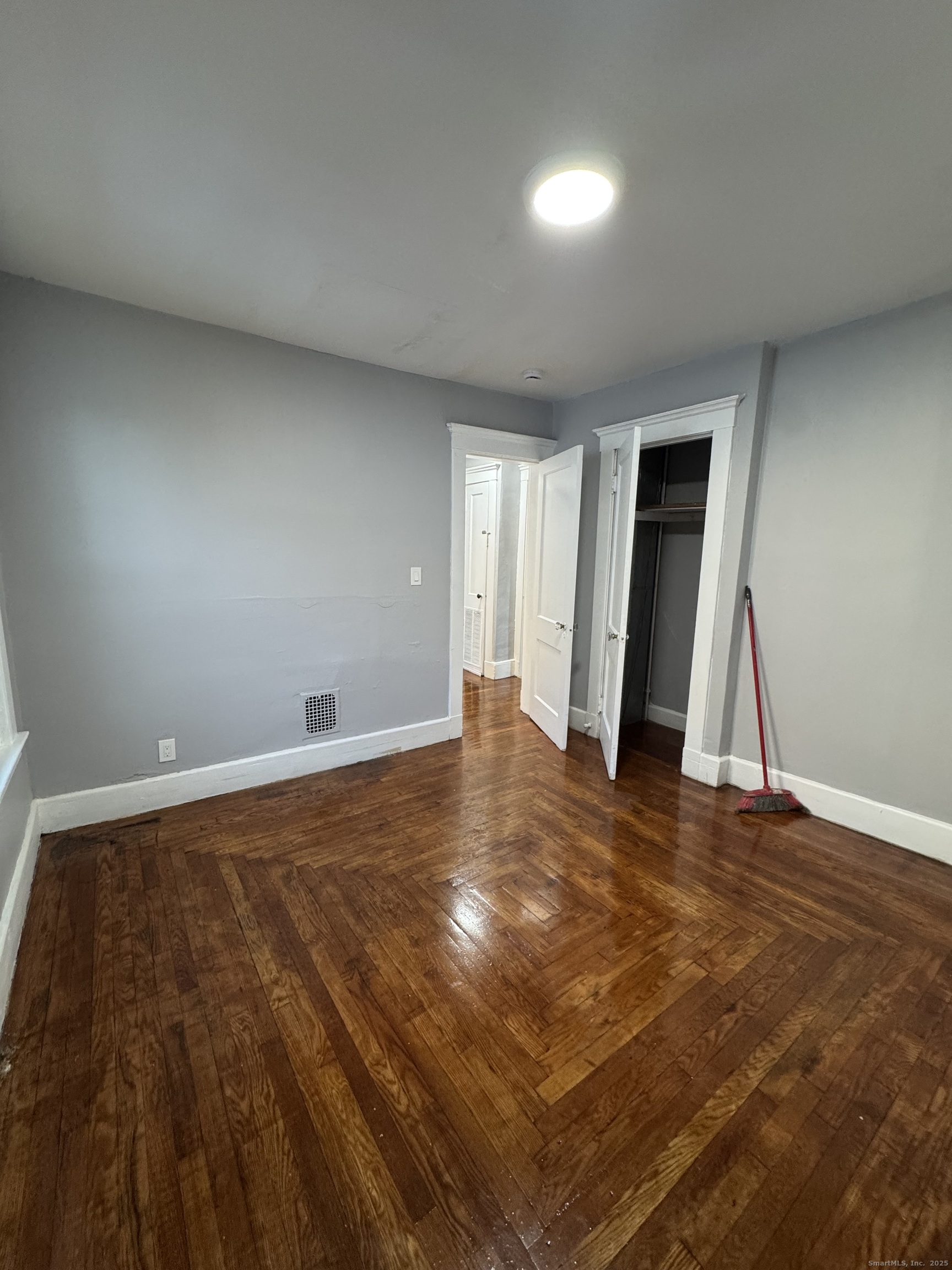 1528 Ella T Grasso Boulevard, Unit 2 New Haven, CT 06511 - Photo 7 of 10 a view of empty room with wooden floor