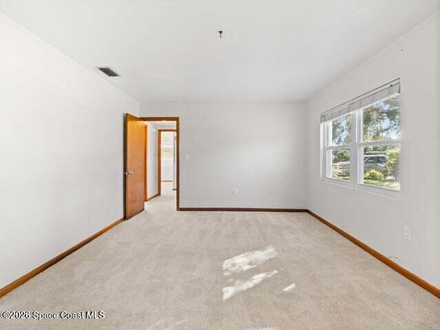 322 3rd Street Merritt Island, FL 32953 - Photo 16 of 37 a view of an empty room with a window
