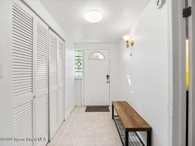 322 3rd Street Merritt Island, FL 32953 - Photo 17 of 37 a view of room with window and wooden floor