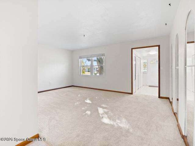 322 3rd Street Merritt Island, FL 32953 - Photo 22 of 37 a view of an empty room with a window