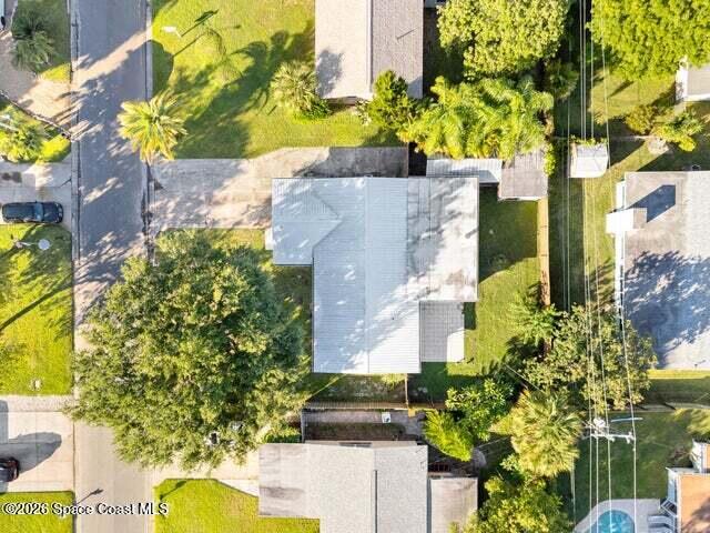 322 3rd Street Merritt Island, FL 32953 - Photo 7 of 37 a aerial view of a house with a yard and garden