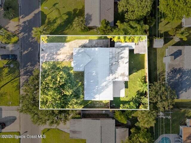 322 3rd Street Merritt Island, FL 32953 - Photo 8 of 37 an aerial view of a house with a yard