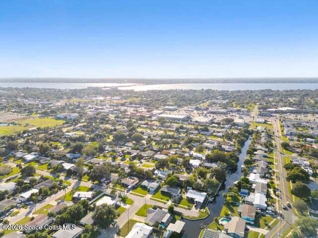 322 3rd Street Merritt Island, FL 32953 - Photo 10 of 37 an aerial view of residential building and trees around