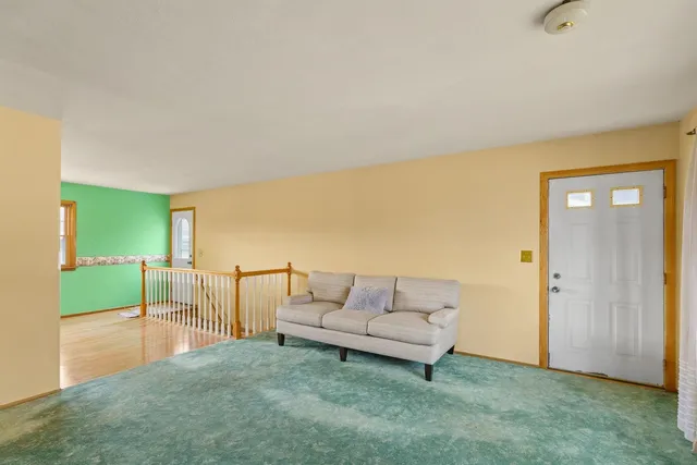 a living room with furniture and a rug