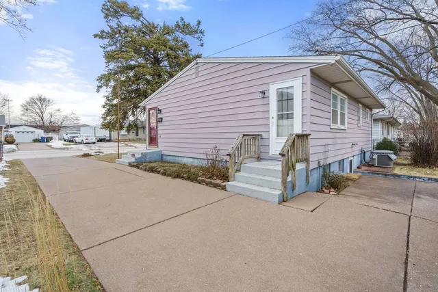 a view of a house with a yard and garage