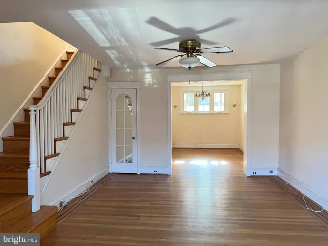 a view of an entryway with wooden floor