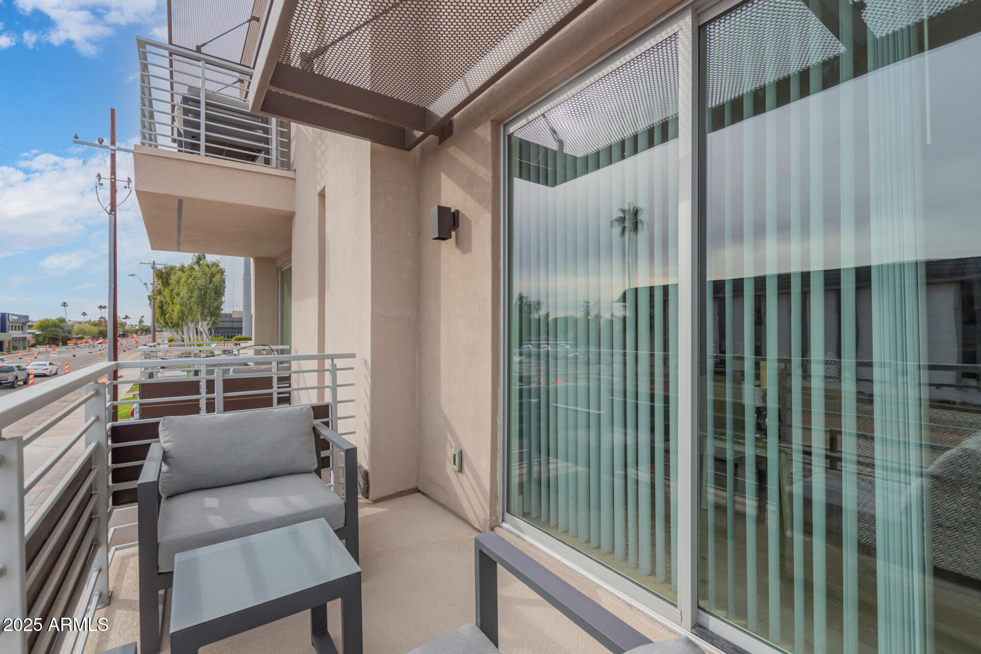 7550 East Osborn Road, Unit 1002 Scottsdale, AZ 85251 - Photo 16 of 23 a view of a balcony with couch