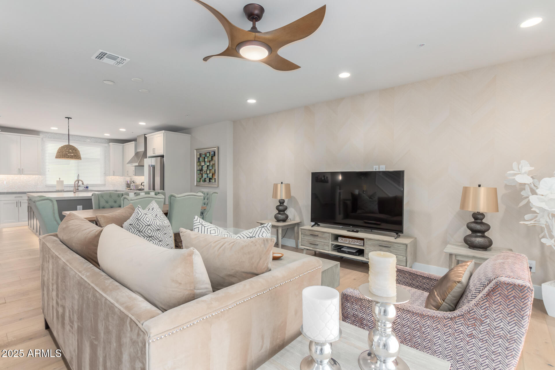 7550 East Osborn Road, Unit 1002 Scottsdale, AZ 85251 - Photo 20 of 23 a living room with furniture and a flat screen tv