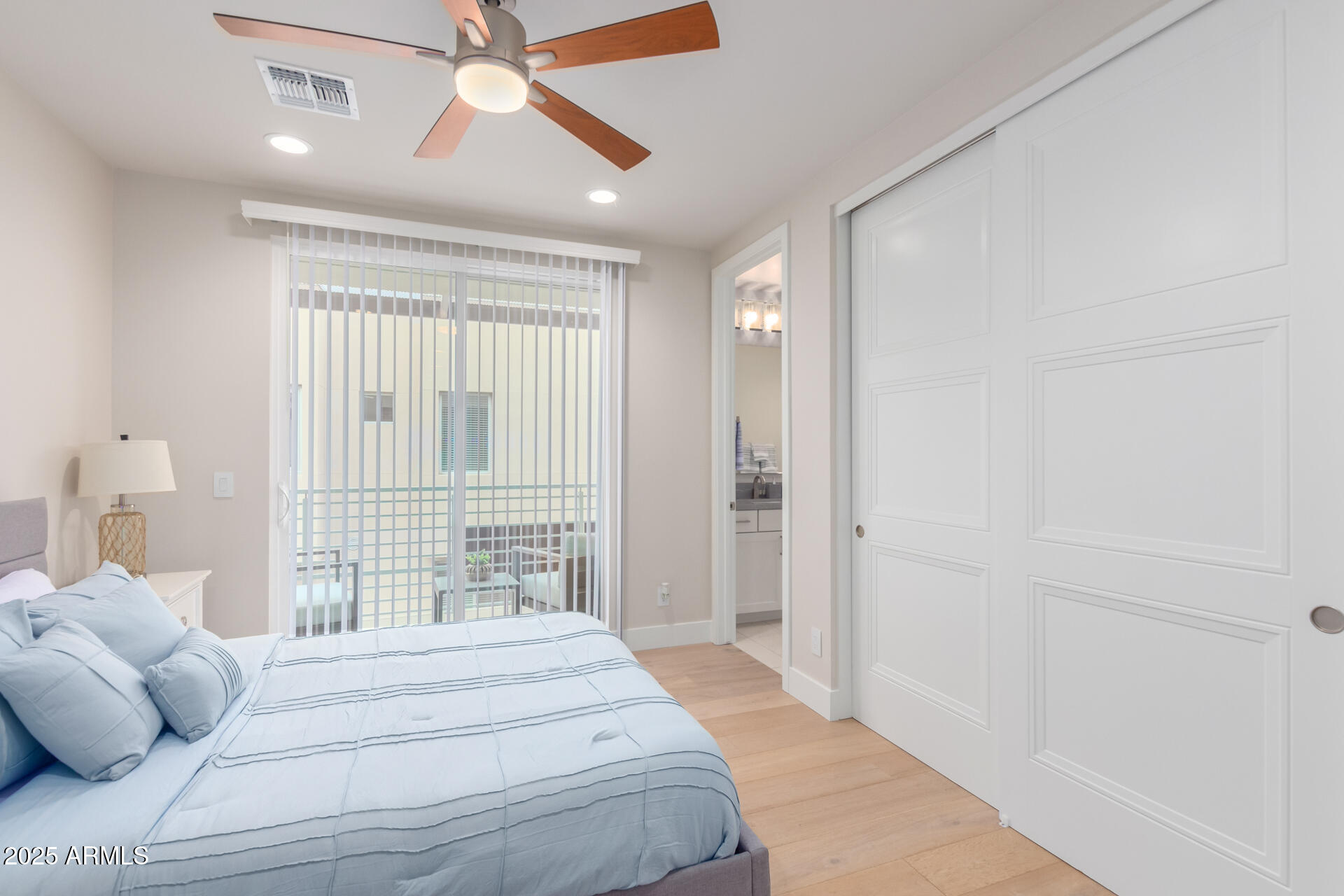 7550 East Osborn Road, Unit 1002 Scottsdale, AZ 85251 - Photo 23 of 23 a bedroom with a bed and a window