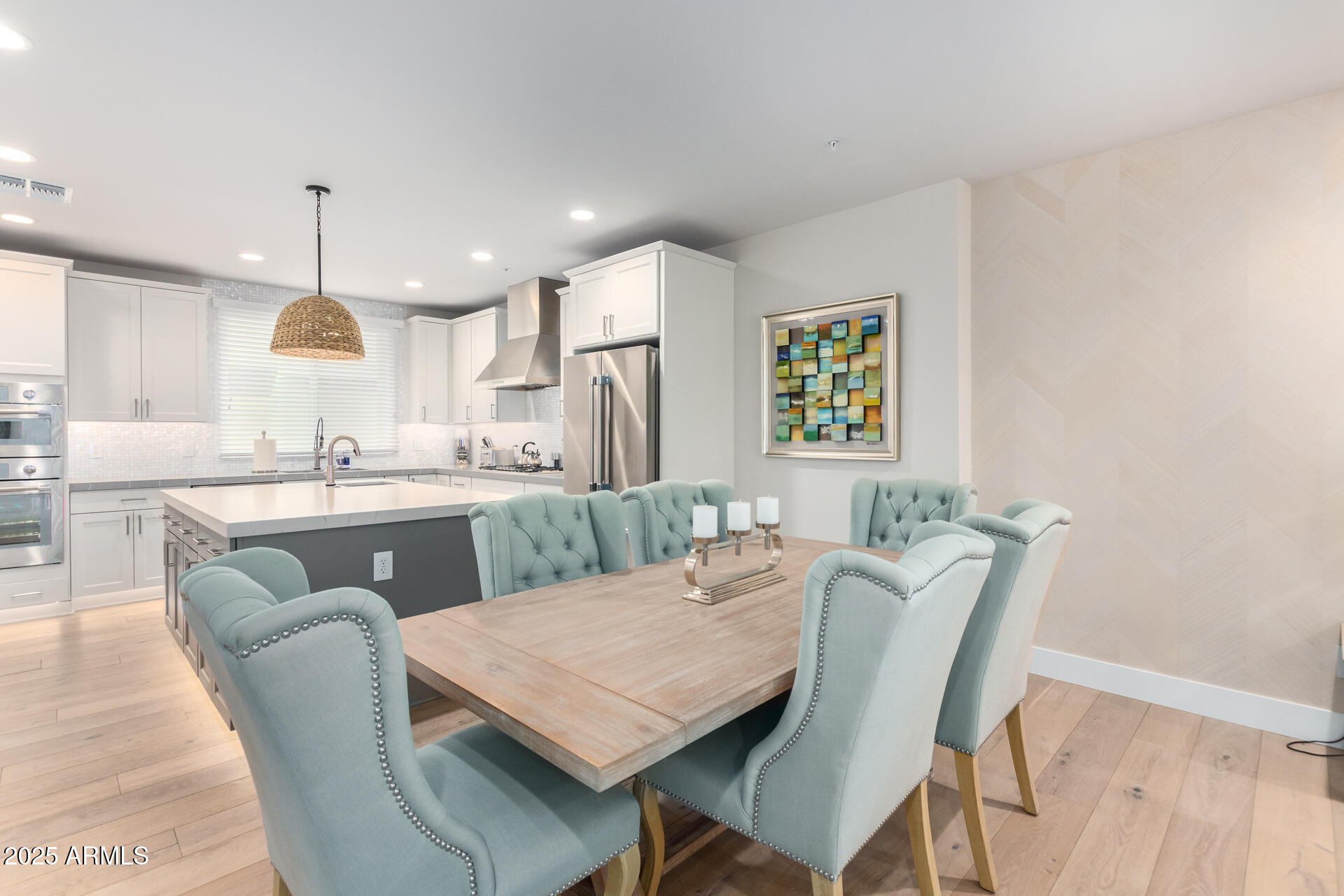 7550 East Osborn Road, Unit 1002 Scottsdale, AZ 85251 - Photo 3 of 23 a dining room with furniture and window