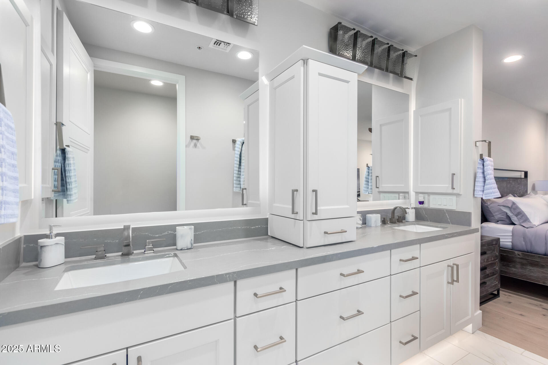 7550 East Osborn Road, Unit 1002 Scottsdale, AZ 85251 - Photo 6 of 23 a bathroom with double sink and a mirror