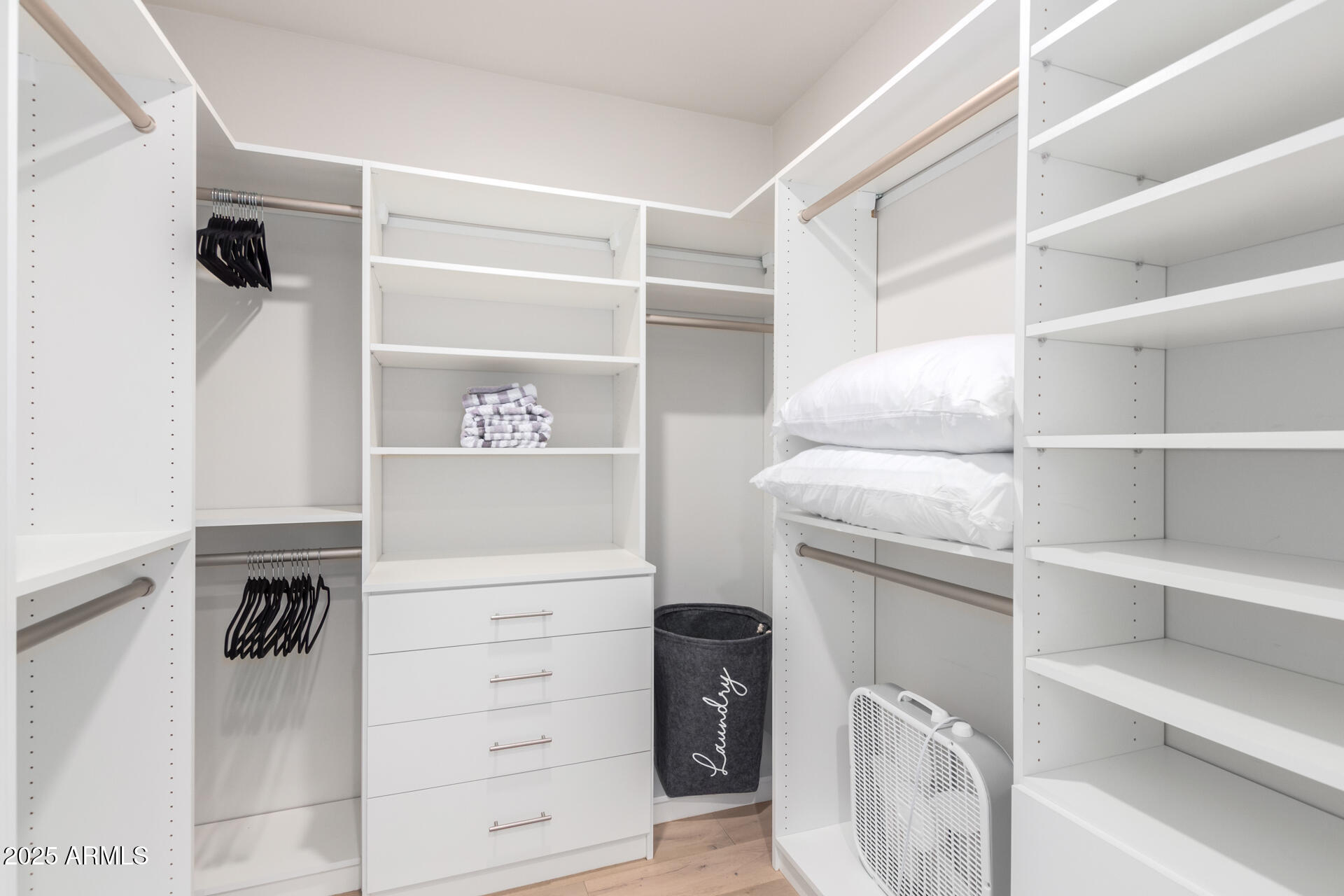 7550 East Osborn Road, Unit 1002 Scottsdale, AZ 85251 - Photo 7 of 23 a view of walk in closet with empty racks